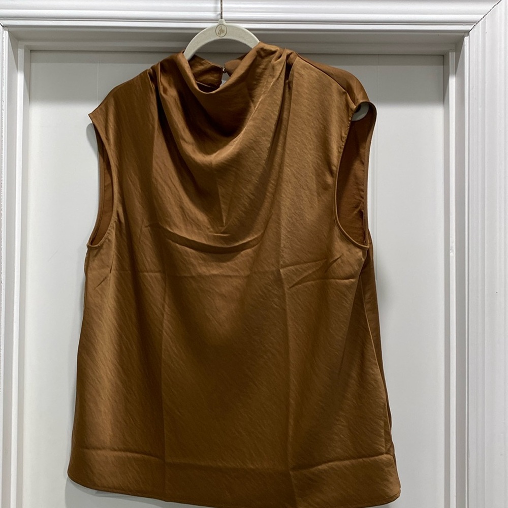 Tobacco blouse. Slightly cap sleeve with small
Drape neck. Never worn.